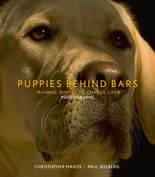 Book cover of: Puppies Behind Bars. By: Paul Solberg; Christopher Makos