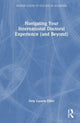 Book cover of: Navigating Your International Doctoral Experience (and Beyond). By: Dely Lazarte Elliot